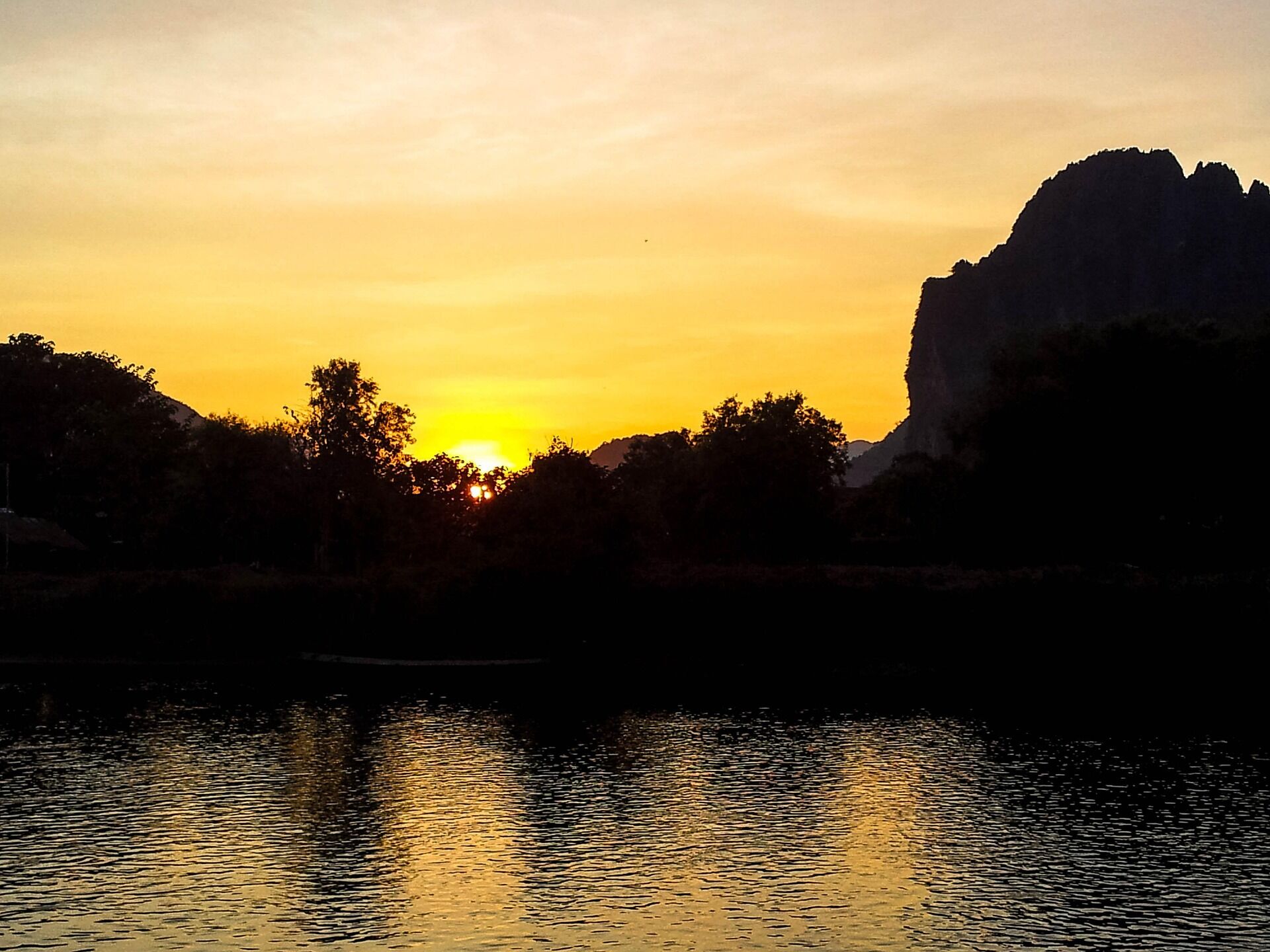 Begin your travel day with Vang Vieng’s serene ambiance